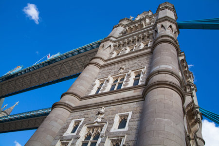 LONDON, UK - AUGUST 16, 2014: Tower bridge and river Thames South bank walk.