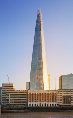 LONDON, UK - APRIL15, 2015: Shard of glass in sunset. Panoramic view of south bank river Thames walk.のeditorial素材