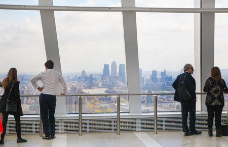 LONDON UK  APRIL 22 2015: People looking at the London's skyline. Viewing platform of WalkieTalkie building. Locates on 32 floor and offering amazing view of the city.のeditorial素材