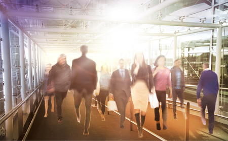 Business people moving blur. People walking in rush hour. Business and modern life conceptの写真素材