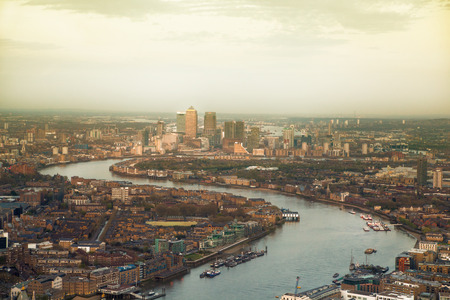 City of London panorama in sunset. Canary Wharf aria and River Thamesの写真素材