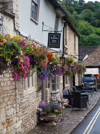 CHIPPENHAM UK  AUGUST 9 2014: Castle Combe unique old English village. Old houseのeditorial素材