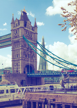 LONDON, UK - APRIL 30, 2015: Tower bridge and city of London view from the River Thamesのeditorial素材