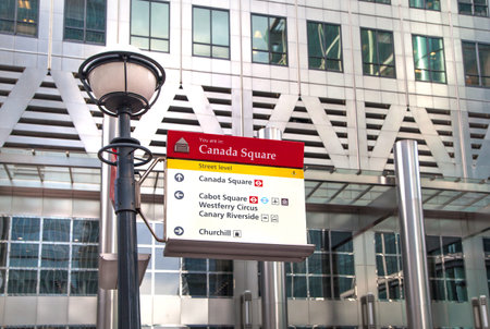 LONDON, UK - MARCH 31, 2015: Canary Wharf  and lantern with singsのeditorial素材