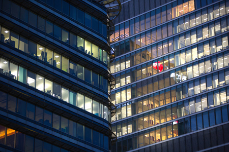 LONDON, UK - 7 SEPTEMBER, 2015: Canary Wharf office's windows lit up in the night.のeditorial素材