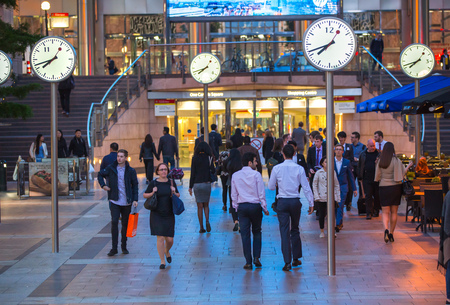 LONDON, UK - 7 SEPTEMBER, 2015: Canary Wharf business life. Business people going home after working day.のeditorial素材