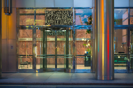 LONDON, UK - 7 SEPTEMBER, 2015: Office building entrance in night light. Canary Wharf night lifeのeditorial素材