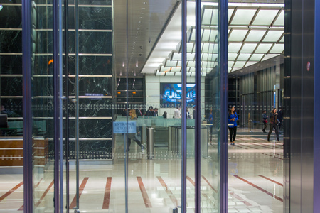 LONDON, UK - 7 SEPTEMBER, 2015: Office building entrance in night light. Canary Wharf night lifeのeditorial素材