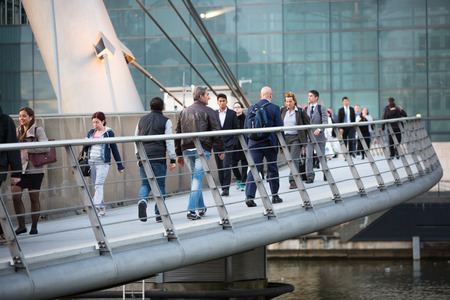 LONDON, UK - 7 SEPTEMBER, 2015: Canary Wharf business life. Business people going home after working day.のeditorial素材