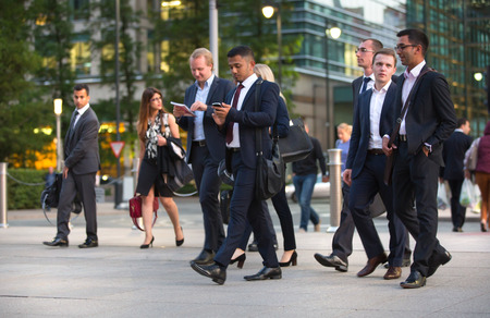 LONDON, UK - 7 SEPTEMBER, 2015: Canary Wharf business life. Business people going home after working day.のeditorial素材
