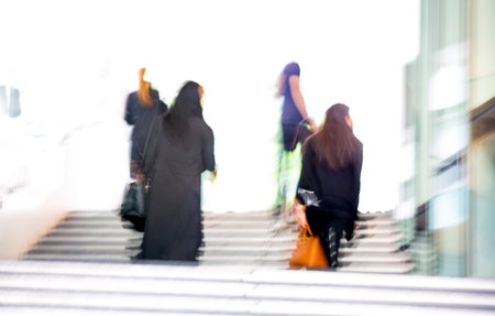 People walking up to stairs, blur background. Londonの写真素材