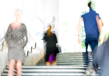 People walking up to stairs, blur background. Londonの写真素材
