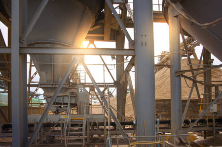 LONDON, UK - MAY 4, 2015: Industrial site at the River Thames. Cement supply. Containers against of...