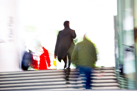 People walking up to stairs, blur background. Londonの写真素材