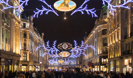 LONDON, UK - NOVEMBER 30, 2014: Black Friday weekend in London the first sale before Christmas. Regent street beautifully decorated with Christmas lights.のeditorial素材