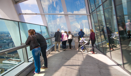 LONDON, UK - APRIL 22, 2015: people watching London skyline from the 32 floor of viewing hallのeditorial素材