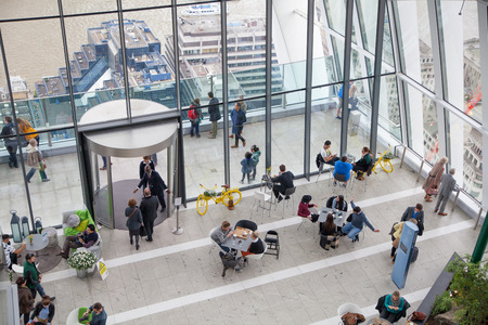 LONDON, UK - APRIL 22, 2015: People in sky cafe resting and enjoying the London panorama from 32 floor of Walkie-Talkie buildingのeditorial素材