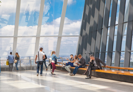 LONDON, UK - APRIL 22, 2015: people watching London skyline from the 32 floor of viewing hallのeditorial素材