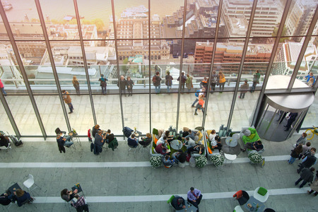 LONDON, UK - APRIL 22, 2015: People in sky cafe resting and enjoying the London panorama from 32 floor of Walkie-Talkie buildingのeditorial素材