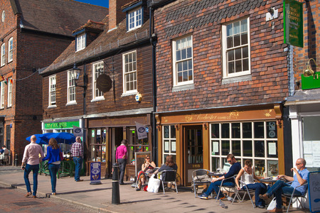 ROCHESTER, UK - MAY 16, 2015: Rochester high street at weekend. People walking through the street, passing cafes, restaurants and shopsのeditorial素材