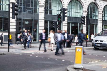 LONDON, UK - APRIL 22, 2015: People walking at City of London street. Motion blurのeditorial素材