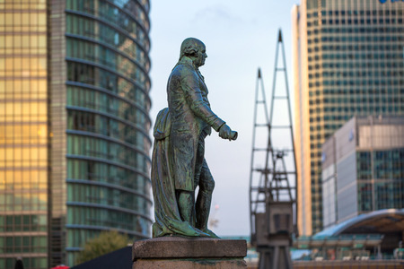 LONDON, UK - SEPTEMBER 9, 2015: Canary Wharf office buildings at sunsetのeditorial素材