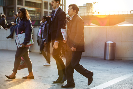 LONDON, UK - SEPTEMBER 9, 2015: Office workers going home after working day in Canary Wharf. Business life of Londonのeditorial素材