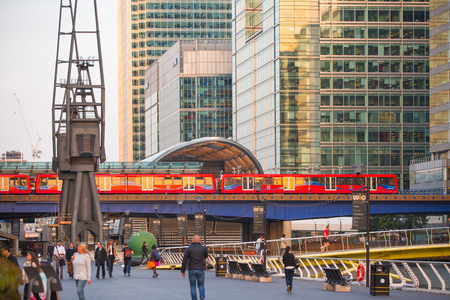 LONDON, UK - SEPTEMBER 9, 2015: DLR train running through the  Canary Wharf business and banking ariaのeditorial素材