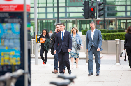 LONDON, UK - SEPTEMBER 9, 2015: Office workers going home after working day in Canary Wharf. Business life of Londonのeditorial素材