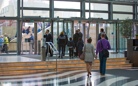 LONDON, UK - SEPTEMBER 9, 2015: Office workers going home after working day in Canary Wharf. Business life of Londonのeditorial素材