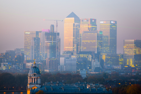 London, UK - October 31, 2015:  Panorama of Canary Wharf in night. View includes the park, Royal chapel, Painted hall and green light of Greenwich zero tome meridianのeditorial素材