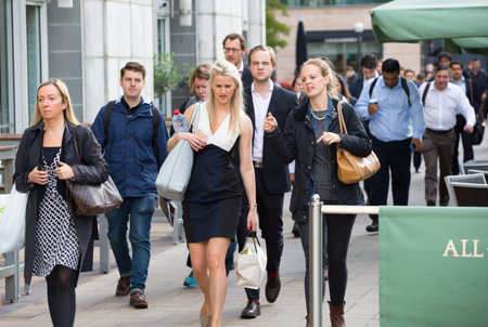 LONDON, UK - SEPTEMBER 14, 2015:  Office workers going to work. Early morning hours in Canary Wharf business lifeのeditorial素材