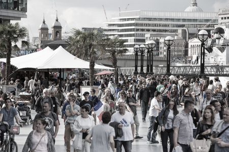 LONDON UK - SEPTEMBER 19, 2015 - Lots of people walking on stairs by river Thames. City of London in weekendのeditorial素材