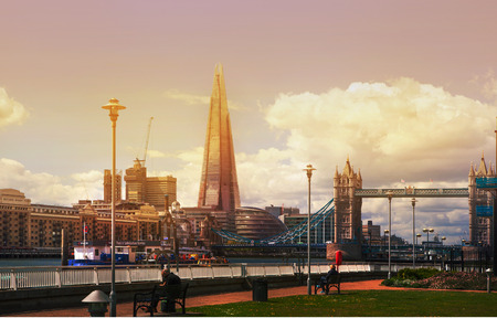 LONDON, UK - APRIL 15, 2015: City of London panorama at sunset. First lights of famous skyscrapers in financial ariaのeditorial素材