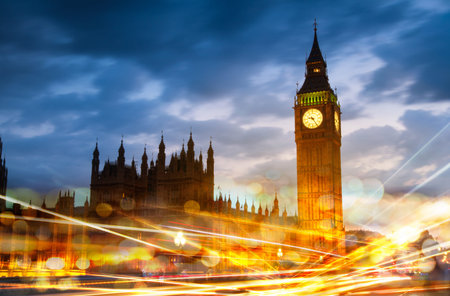 Night view of Big Ben with traffic lights reflections