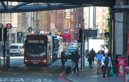LONDON, UK - SEPTEMBER 10, 2015: City of London buddy street and lots of people crossing the road.