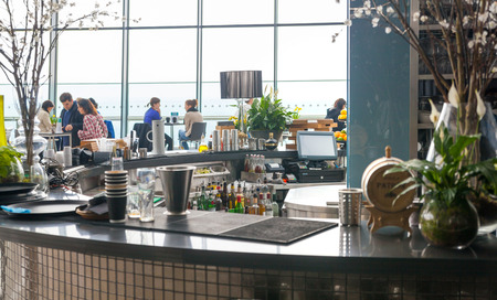 LONDON, UK - APRIL 22, 2015: People in sky cafe resting and enjoying the London panorama from 32 floorのeditorial素材