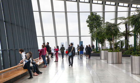 LONDON, UK - APRIL 22, 2015: People in sky cafe resting and enjoying the London panorama from 32 floor of Walkie-Talkie buildingのeditorial素材