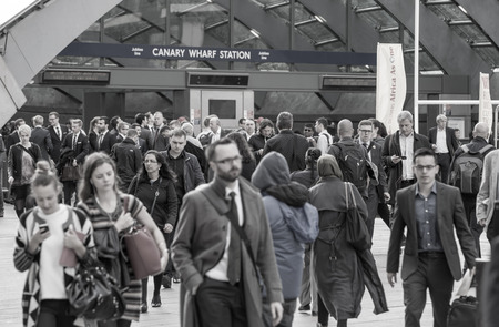 LONDON, UK - SEPTEMBER 14, 2015: Office workers going at work. Early morning hours in Canary Wharf business lifeのeditorial素材