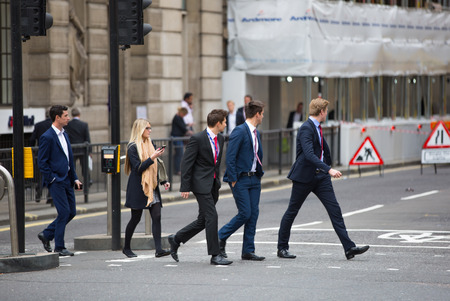LONDON, UK - OCTOBER 14, 2015. People crossing the road by the Bank of Englandのeditorial素材