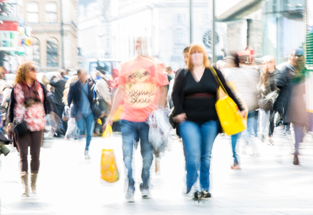 Lots of people, tourists and Londoners walking via Leicester square, Blur backgroundのeditorial素材