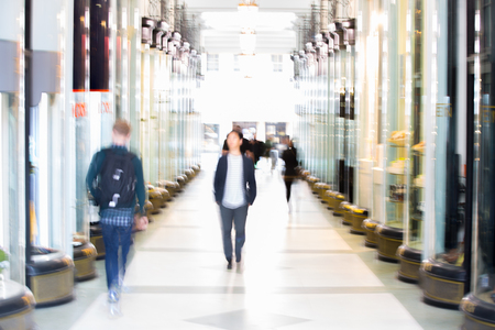 People walking in gallery, which connecting two streets. Blurred backgroundのeditorial素材