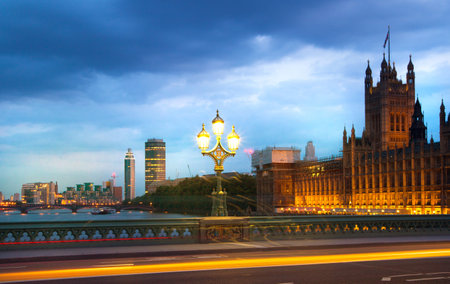 Big Ben and Houses of Parliament at sunset and first night lights