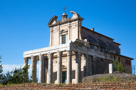 ROME, ITALY - APRIL 8, 2016: Ruins of old temple at  Roman's forum against of blue skyのeditorial素材