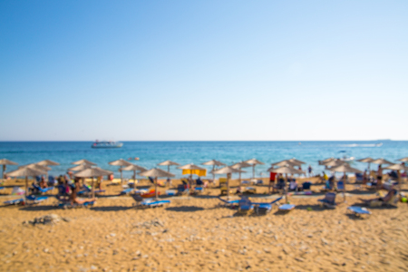 Blurred image of straw umbrellas line on beach, Holiday conceptの写真素材