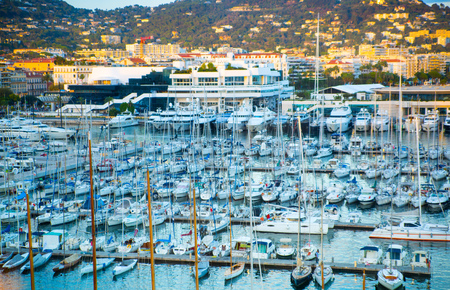 CANNES, FRANCE - 19 SEPTEMBER, 2016:  Old Port Vieux Port in the city of Cannes at sunset. Lots of sailing boats and power yachts anchored during the Sailing regatta.のeditorial素材