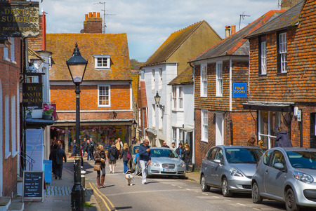 RYE, UK - 1 MAY, 2016: High street of Old Rye town with periodic buildings, lots of people and cars parked on side.のeditorial素材