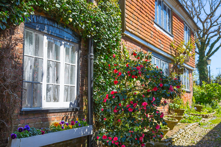 RYE, UK - 1 MAY, 2016: Old street of Rye town with periodic buildings. Mermaid Street showing typically steep slope and cobbled surfaceのeditorial素材