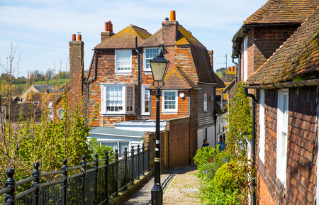 RYE, UK - 1 MAY, 2016: Old street of Rye town with periodic buildings. Mermaid Street showing typically steep slope and cobbled surfaceのeditorial素材