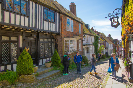 RYE, UK - 1 MAY, 2016: Old street of Rye town with periodic buildings. Mermaid inn and Street showing typically steep slope and cobbled surfaceのeditorial素材